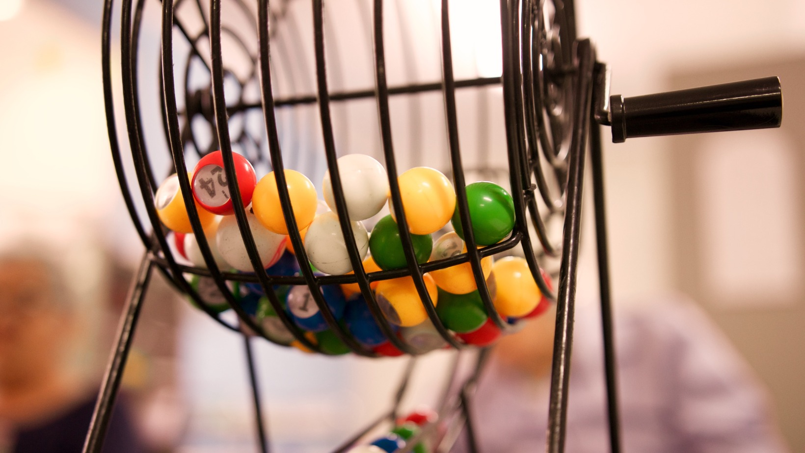 Bingo machine, bingo cage, lottery balls, game, numbers, entertainment, raffle, chance.